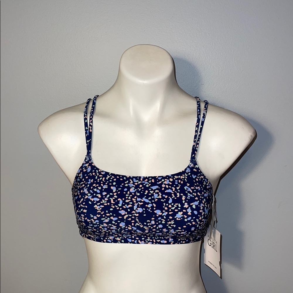 Athleta Girl Reversible Gold Coast Bikini Top. NWT. XXL/16.
Navy blue and floral